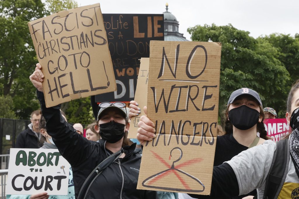 Marchers hold up signs during a Mothers Day rally in support of Abortion (Photo by Jemal Countess/Getty Images for Supermajority)